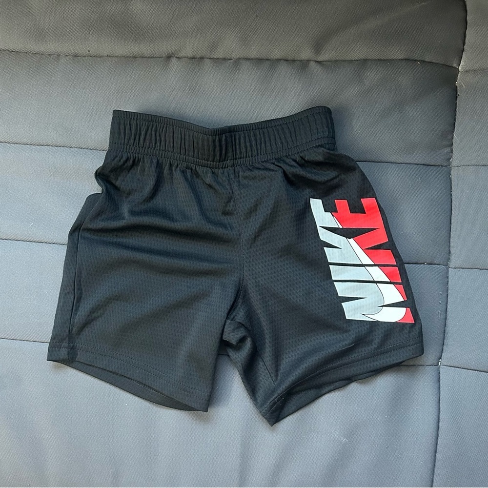 Nike Kids Black Shorts with Red Logo